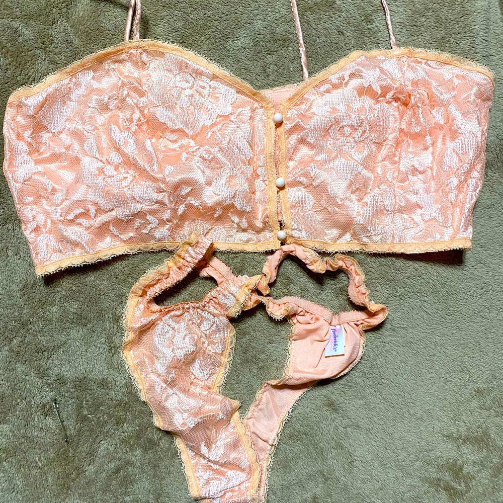 Peach top and bottoms. Has hooks in front to close. Like new